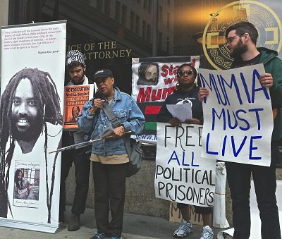 Pam Africa (with mic) and Abu-Jamal supporters protest outside office of Philadelpia's DA. -LBWPhoto